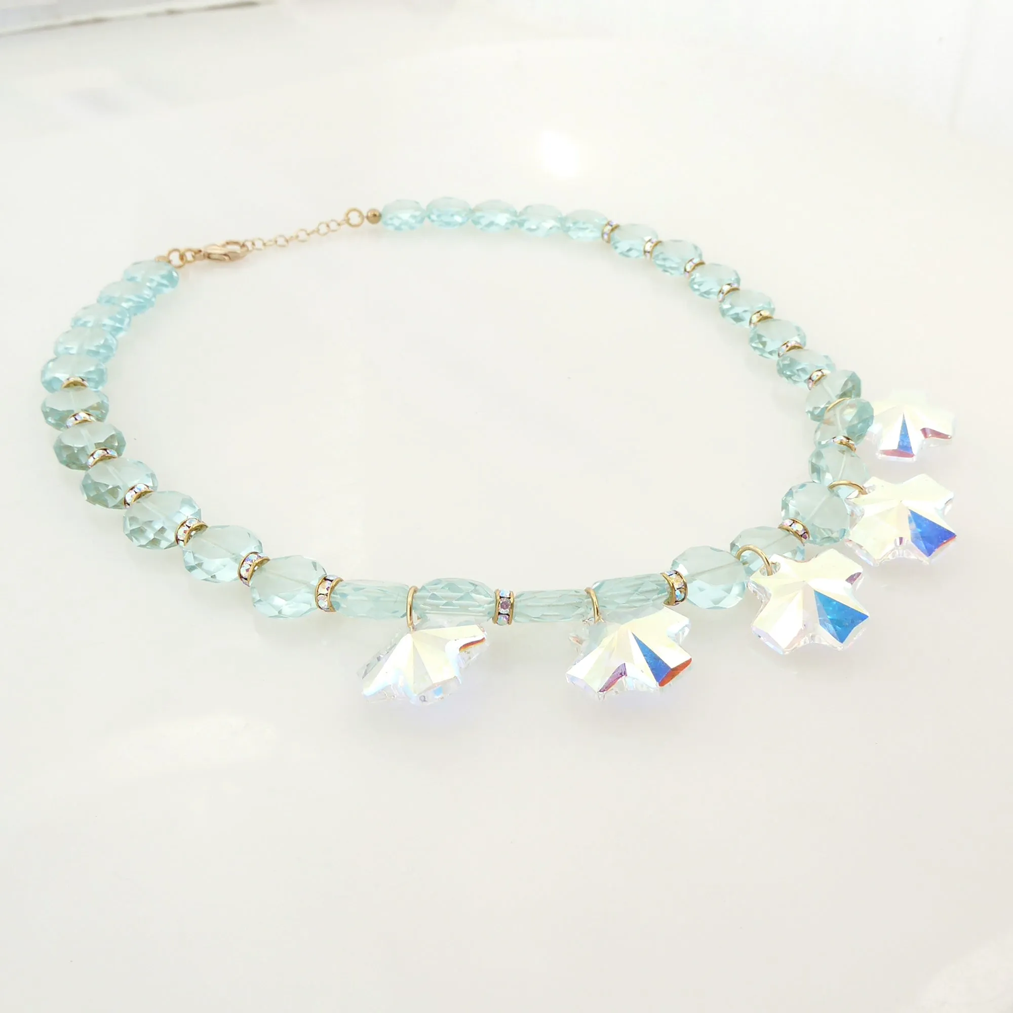 Iridescent crystal cross necklace