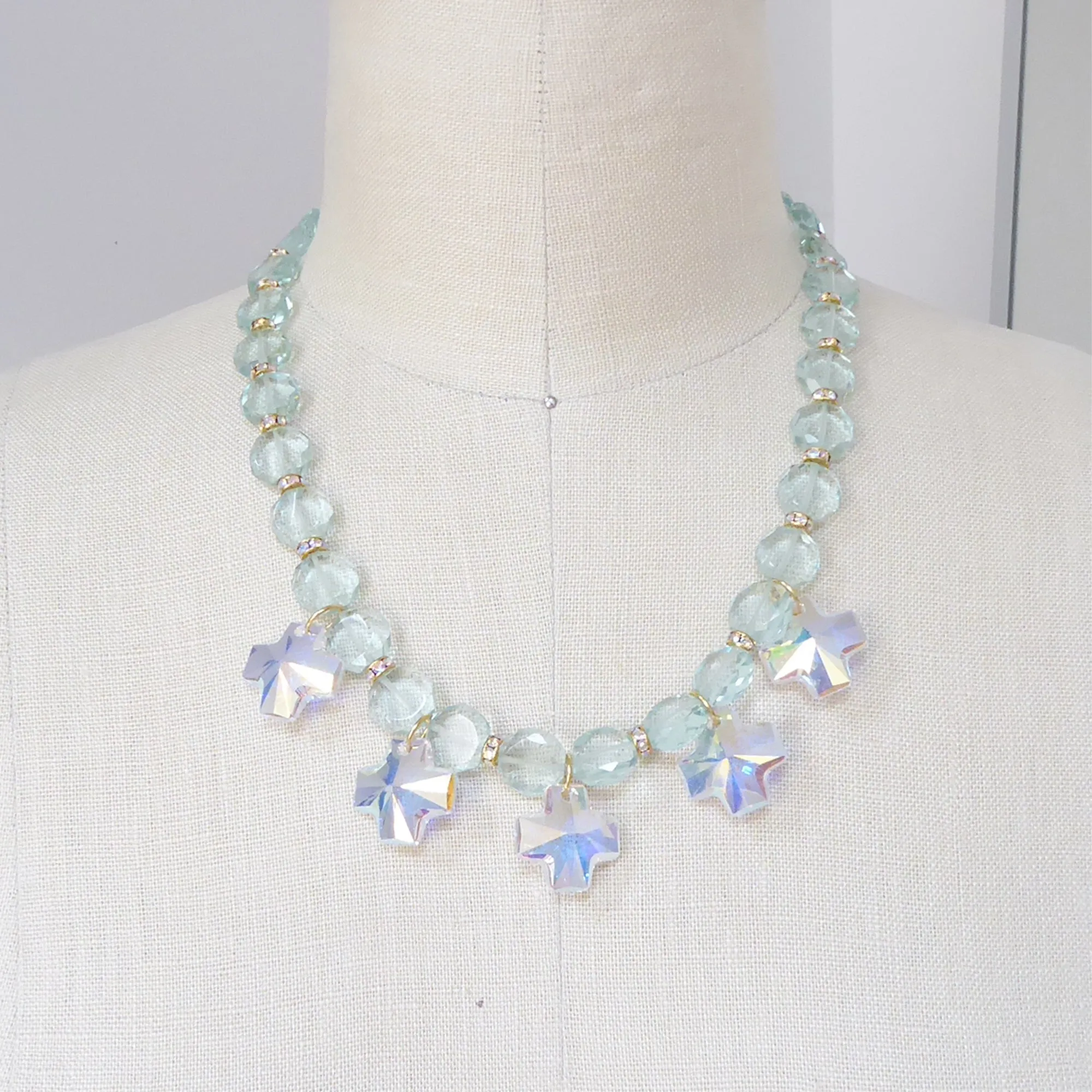 Iridescent crystal cross necklace